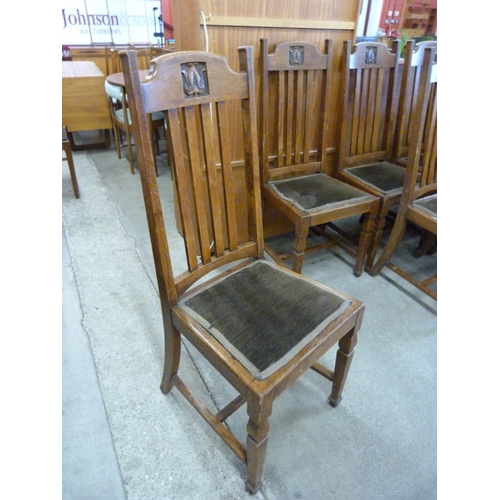 143 - A set of six Arts and Crafts oak dining chairs