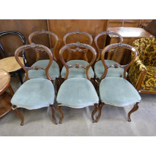 147 - A set of six Victorian walnut balloon back dining chairs