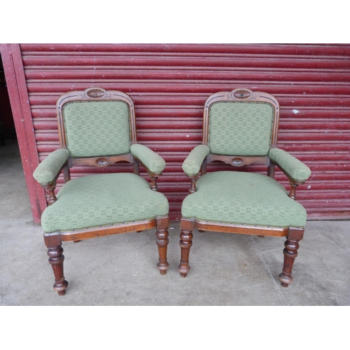 176b - A pair of Victorian mahogany and green fabric upholstered library chairs