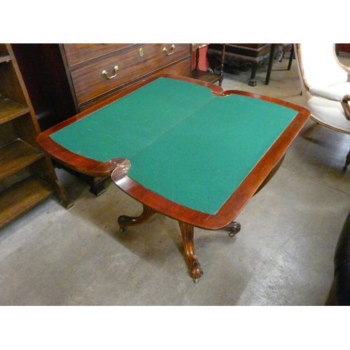 18 - A Victorian mahogany fold over games table