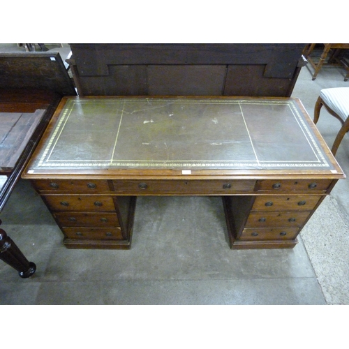 189 - A Victorian mahogany and green leather topped library desk