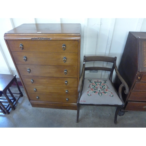 241 - An oak chest of drawers, a bookcase, two stools, trolley etc.