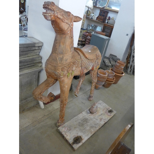 249 - A large carved hardwood carousel style stargazer horse