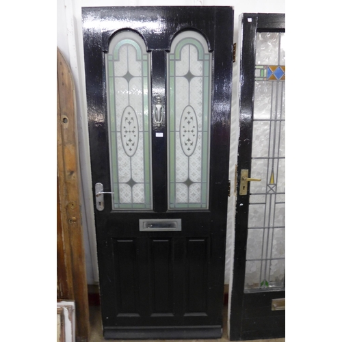 258 - A painted door with coloured glass panels