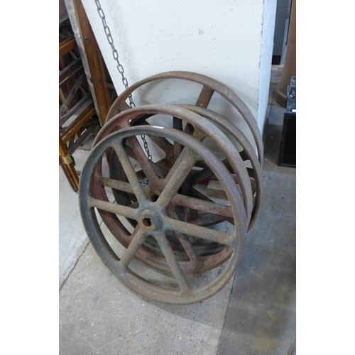 260 - Four vintage cast iron wheels