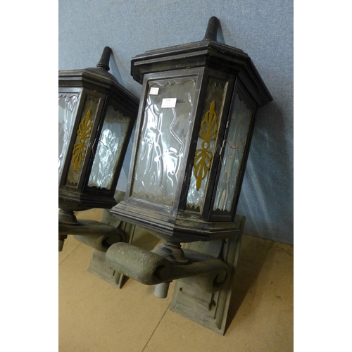 274 - A pair of painted alloy lanterns, on bronze brackets