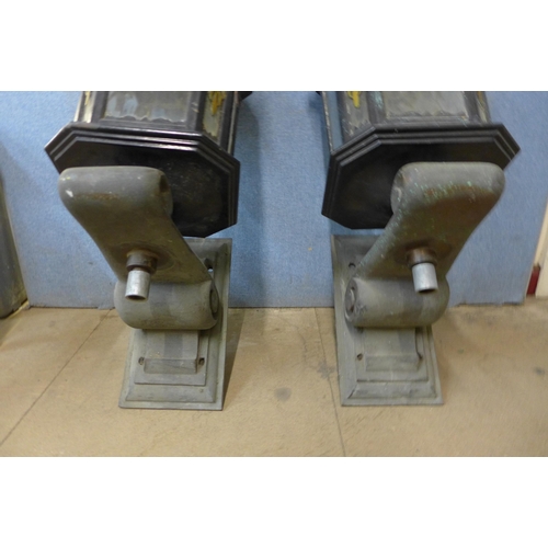 274 - A pair of painted alloy lanterns, on bronze brackets