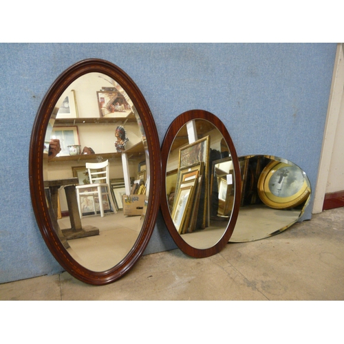 331 - Three assorted oval mirrors