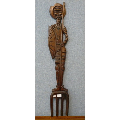 332 - A large carved wood fork