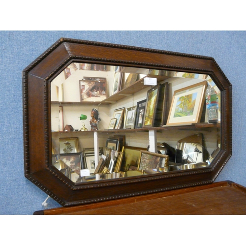 357 - An oak octagonal framed mirror