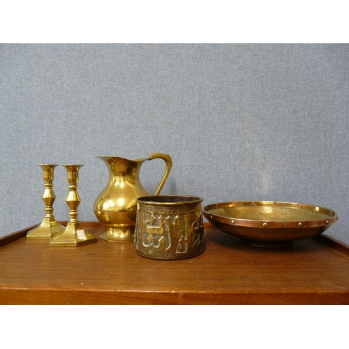 360a - An Arts and Crafts copper and brass bowl, pair of brass candlesticks and two others