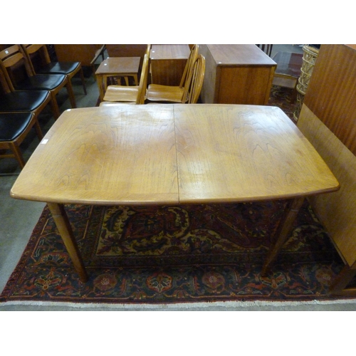 90 - A Meredew teak extending dining table