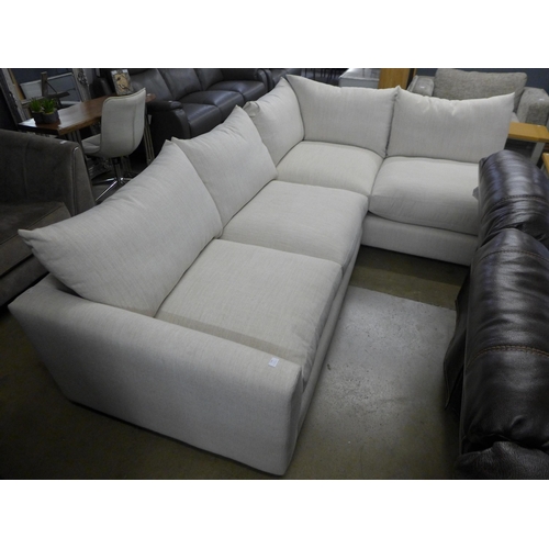 1398 - A linen upholstered RHF corner sofa