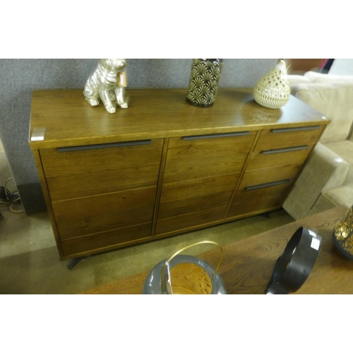 1423 - A Sapporo fixed top darkwood and black metal two door three drawer sideboard