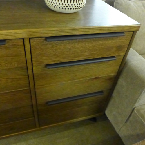 1423 - A Sapporo fixed top darkwood and black metal two door three drawer sideboard