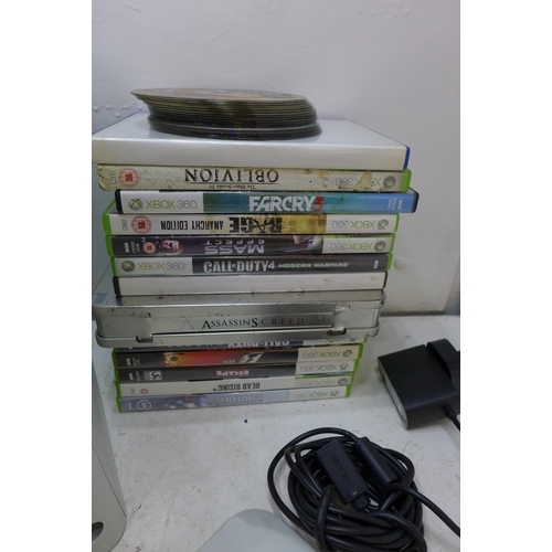 2198 - Two Xbox 360 consoles with leads, controllers and games