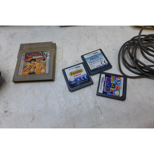 2200 - 2 x Nintendo DS copnsoles and quantity of games