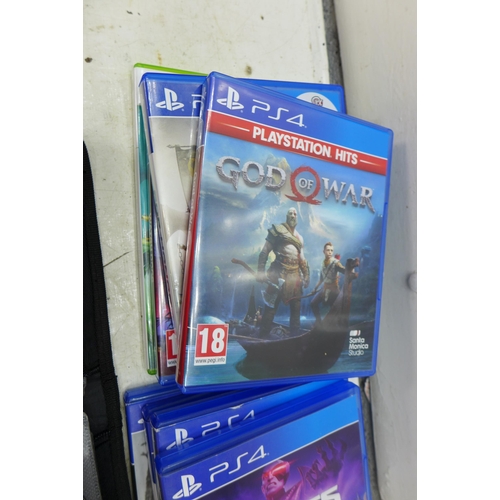 2208 - Seven PS4 games and approx 15 Xbox 360 games in wallet, etc.