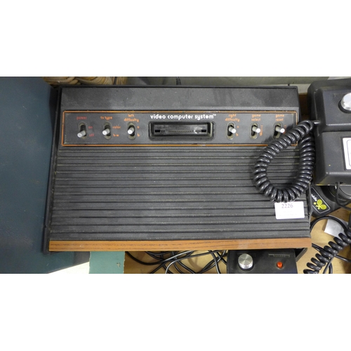 2226 - Atari 2600 Woody vintage gaming console with 7 games and vintage Grandstand game - both W with joyst... 