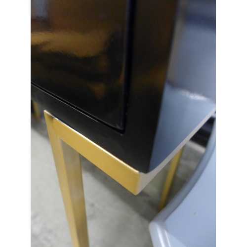 1706 - A black two drawer console table with gold legs