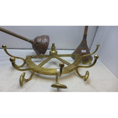 2041 - Vintage style yellow metal ship's wheel coat hook and two vintage laundry ponchers (Simplex 9)