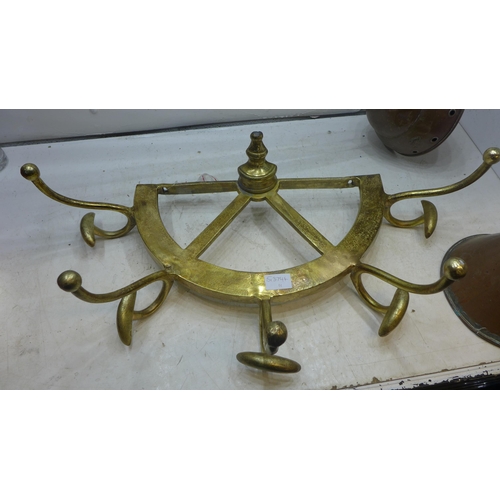 2041 - Vintage style yellow metal ship's wheel coat hook and two vintage laundry ponchers (Simplex 9)