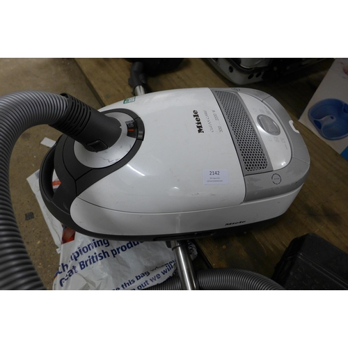 2142 - Miele clean and care 300 2200w cylinder vac with 3 main tools and 3 onboard tools, - W