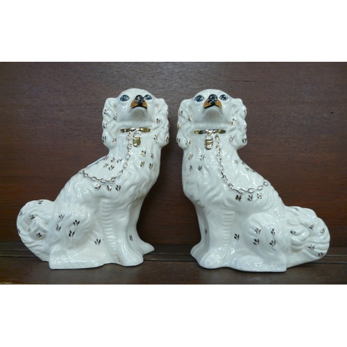 605 - A pair of Staffordshire Spaniels, 30cm