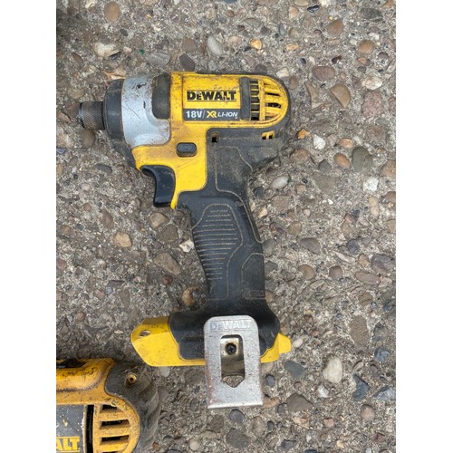 2028 - Three Dewalt impact drivers with Dewalt drill and charger