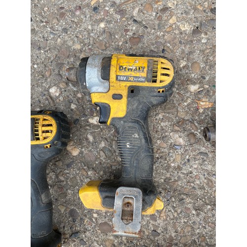 2028 - Three Dewalt impact drivers with Dewalt drill and charger