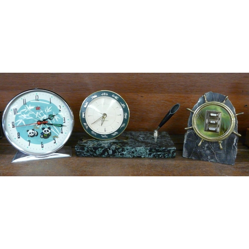 626 - A Russian alarm clock, a granite ships wheel calendar and a marble based clock and pen stand