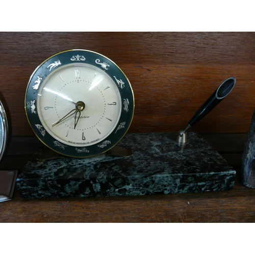 626 - A Russian alarm clock, a granite ships wheel calendar and a marble based clock and pen stand