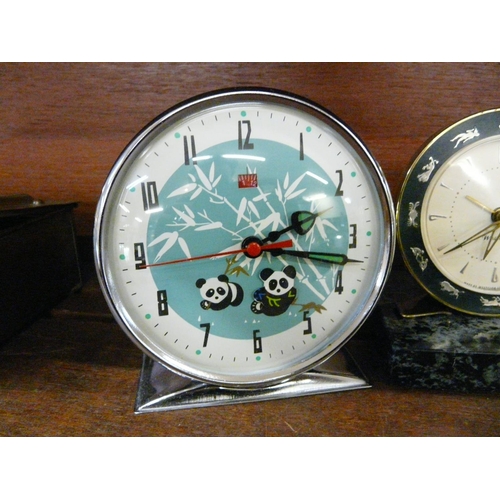 626 - A Russian alarm clock, a granite ships wheel calendar and a marble based clock and pen stand