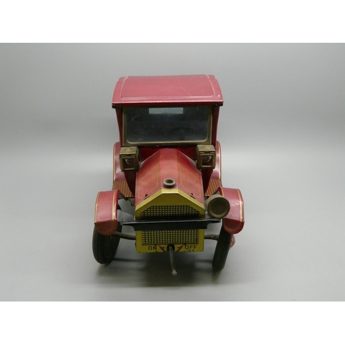 633 - A Japanese tin-plate model vehicle, marked, 'TN Toys, made in Japan', one headlight a/f