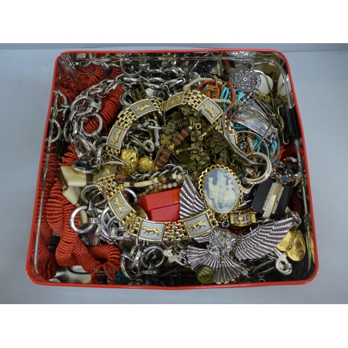 651 - A tin of costume jewellery