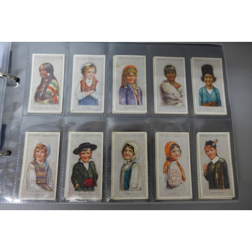 668 - Cigarette cards;-an album with ten complete sets, including Ogden's 'Children of all Nations', etc.