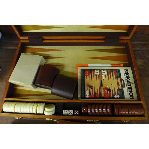 680 - A cased Backgammon set and a Cribbage set, boxed