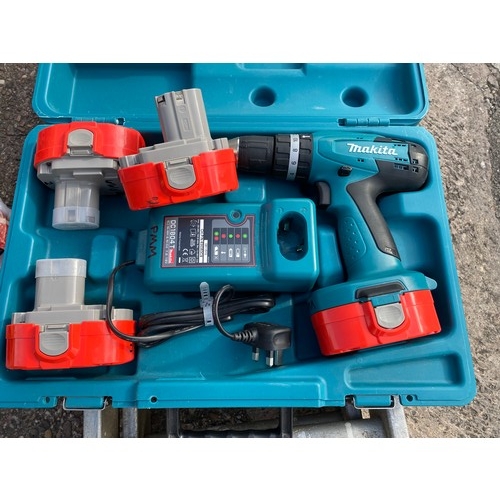 2002 - Makita 18V cordless drill (8391D) with four batteries and charger - W