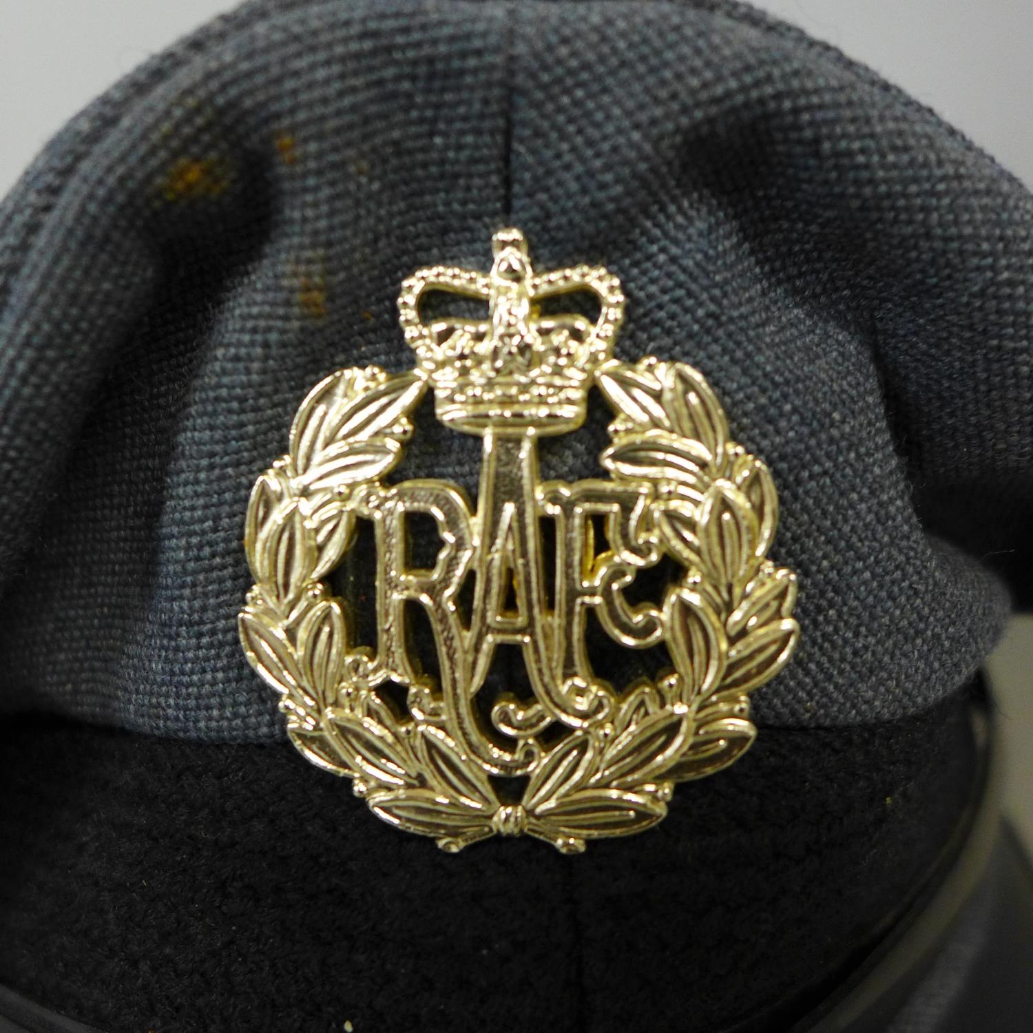 A RAF service peaked cap with badge (size 58)