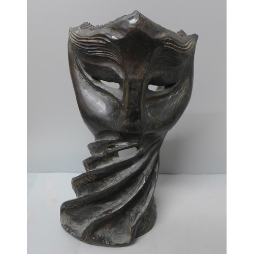 761 - A carved wooden mask, 30cm