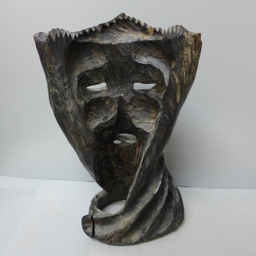 761 - A carved wooden mask, 30cm