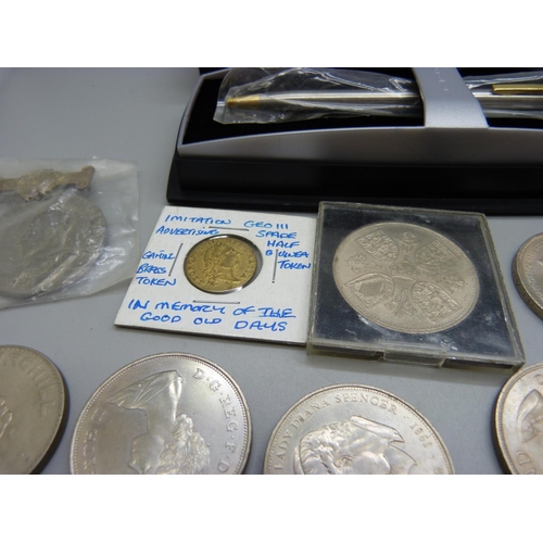 856 - A collection of commemorative coins and a Cross pen