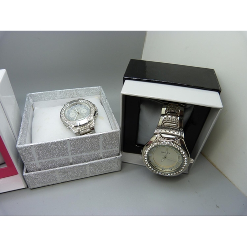 864 - Five wristwatches, boxed