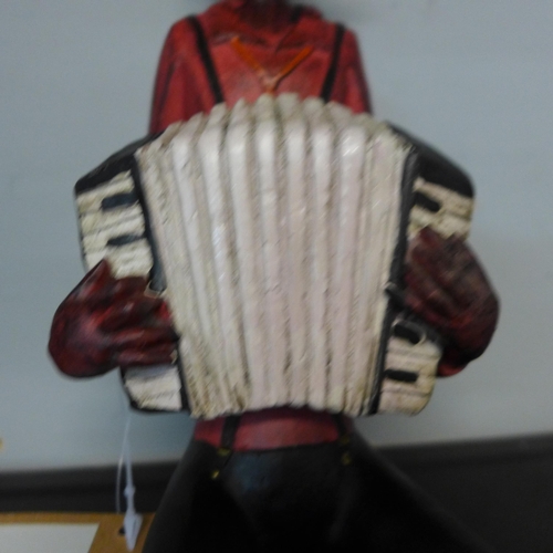 1313 - A sitting jazz band squeeze box player H 40cms (026312)   #