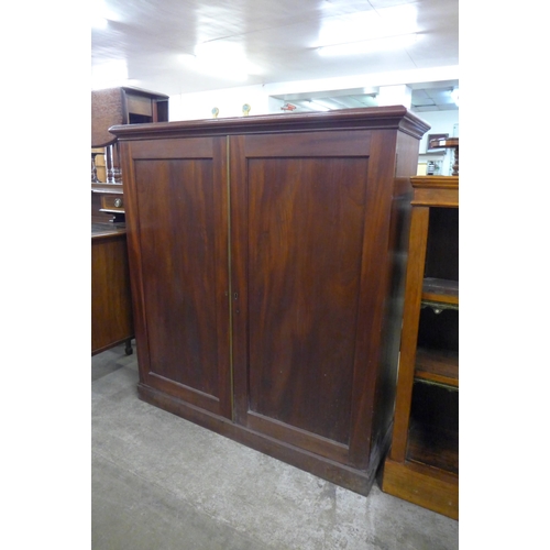 100 - A George IV mahogany two door enclosed bookcase