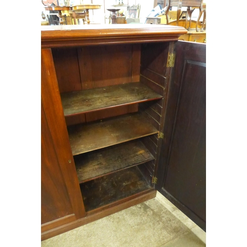 100 - A George IV mahogany two door enclosed bookcase