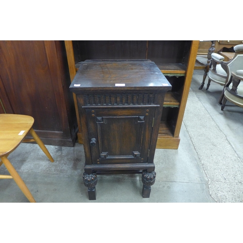 102 - A Jacobean Revival oak pot cupboard