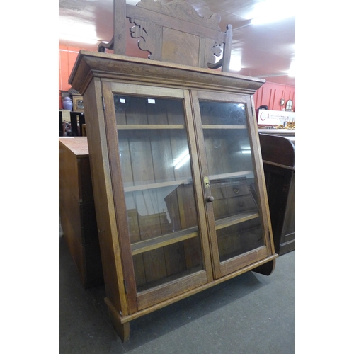 113 - An Edward VII oak wall hanging bookcase, the brass escutcheon stamped; Kingfisher Limited, West Brom... 