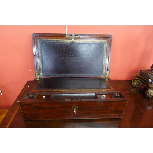 14 - A 19th Century mahogany and brass mounted campaign writing slope