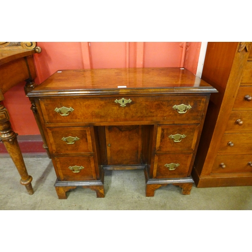 2 - A George I style figured walnut kneehole desk